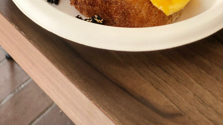 An omelette on toast with crispy seaweed and sesame on top
