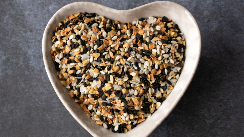 Everything bagel seasoning in a heart-shaped dish