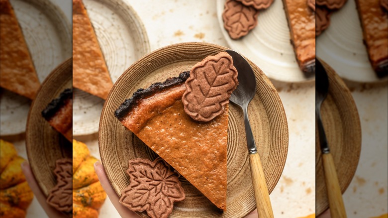 Pumpkin pie with leaf shaped decorations