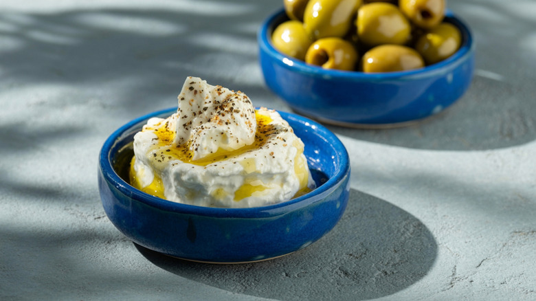 Labneh, a yogurt cream cheese, is garnished with oil and pepper
