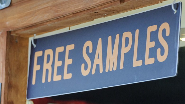 Blue hanging sign reading free samples