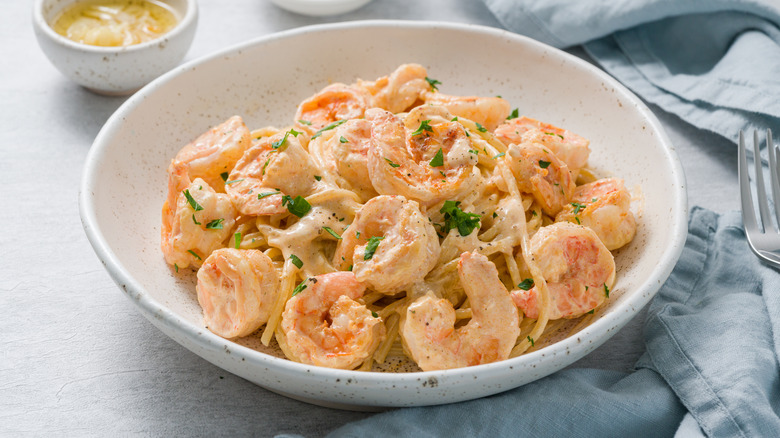 linguine with shrimp in white dish