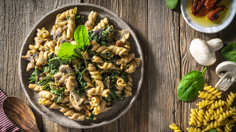 fusili with spinach on plate
