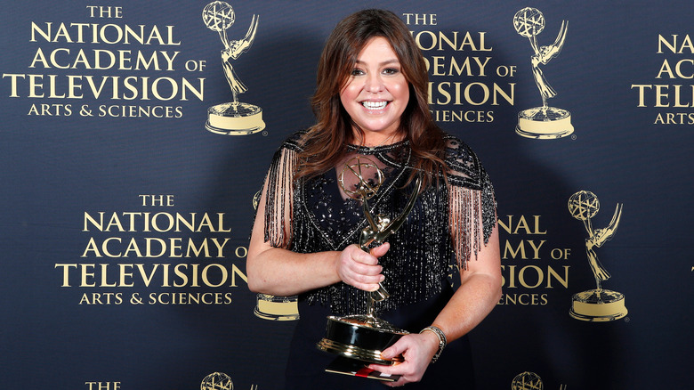 Rachael Ray smiling and posing with her Daytime Emmy
