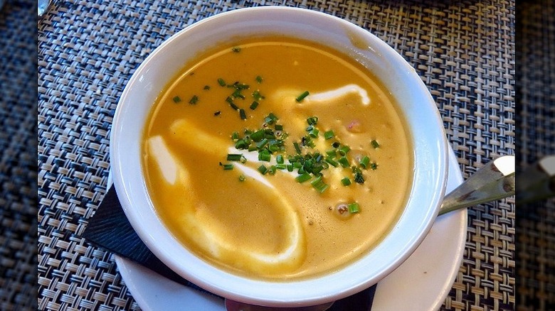 Del Frisco's Double Eagle Steakhouse's lobster bisque rests in a white bowl