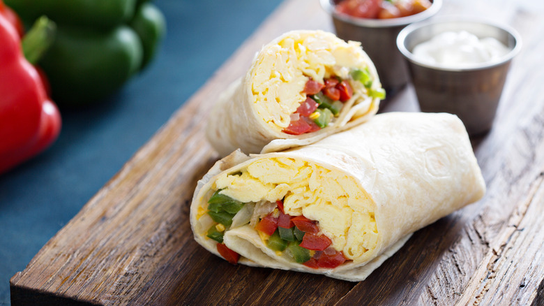 Vegetarian breakfast wrap with eggs and bell peppers