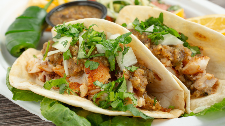 Grilled fish tacos with salsa on a plate