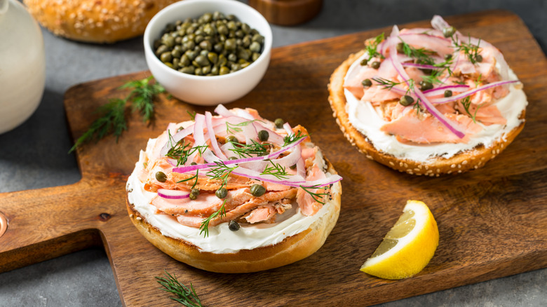 Bagel with lox, cream cheese, and capers on a plate