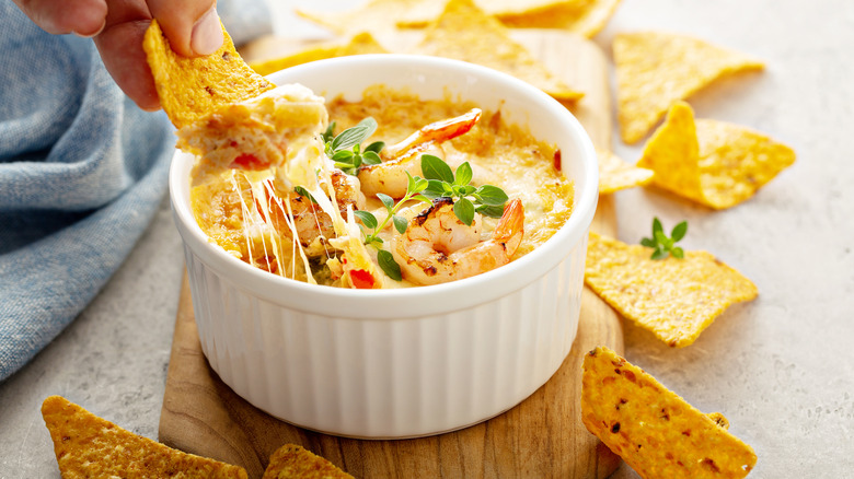 Hot crab dip with cheese and cracers