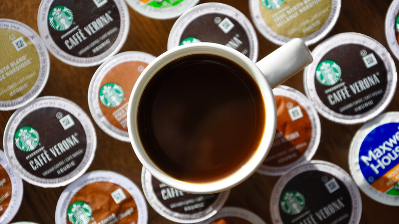 mug of coffee sitting on top of K-Cups