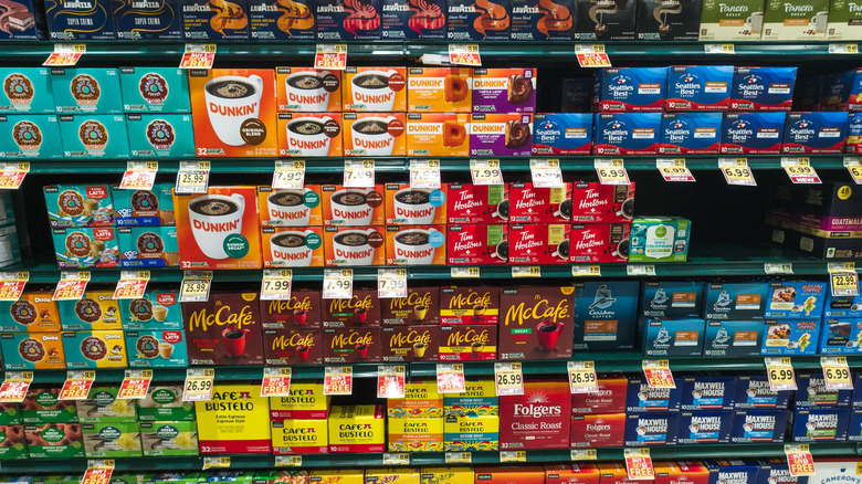 grocery store aisle featuring many K-Cup varieties