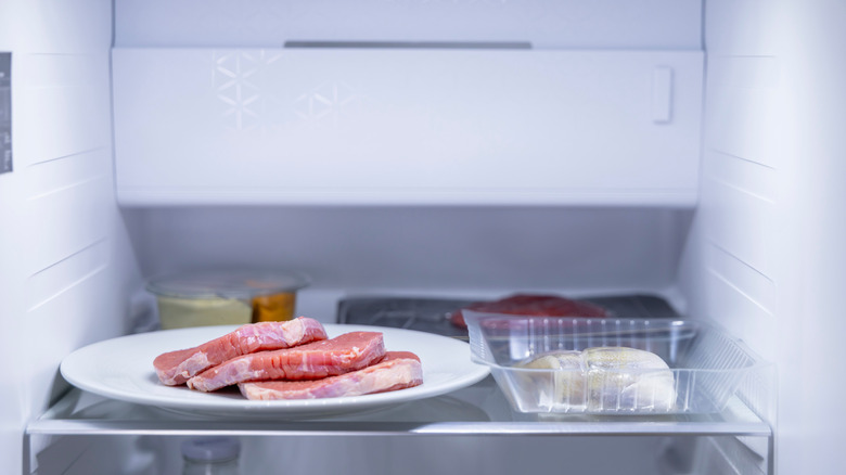 Sliced raw meat in a refrigerator