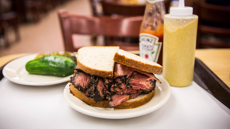 Smoked pastrami sandwich with condiments