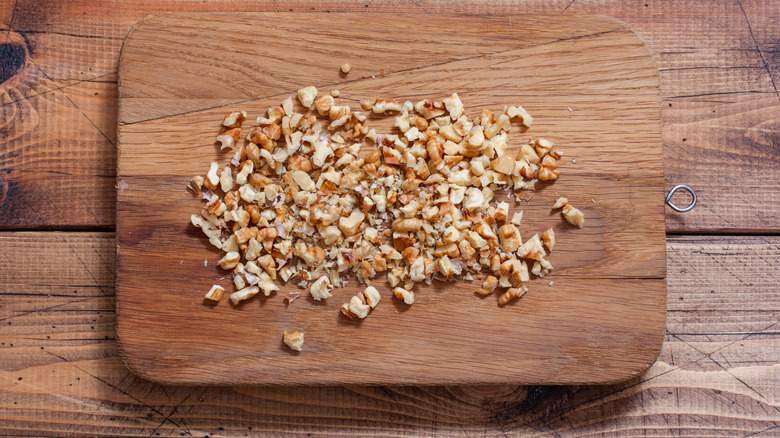 Chopped walnuts on a wooden board