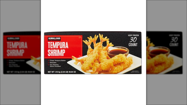 A box of tempura shrimp sits against a white background.