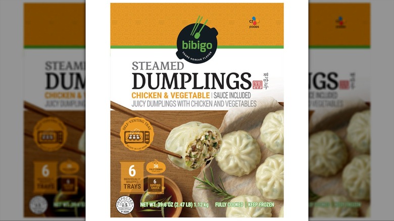 A box of dumplings sits against a white background.