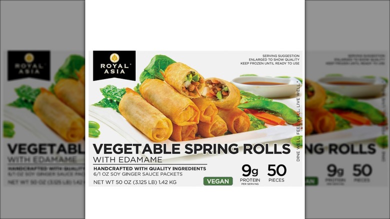 A box of spring rolls sits against a white background.