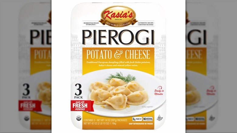 A box of pierogi sits against a white background