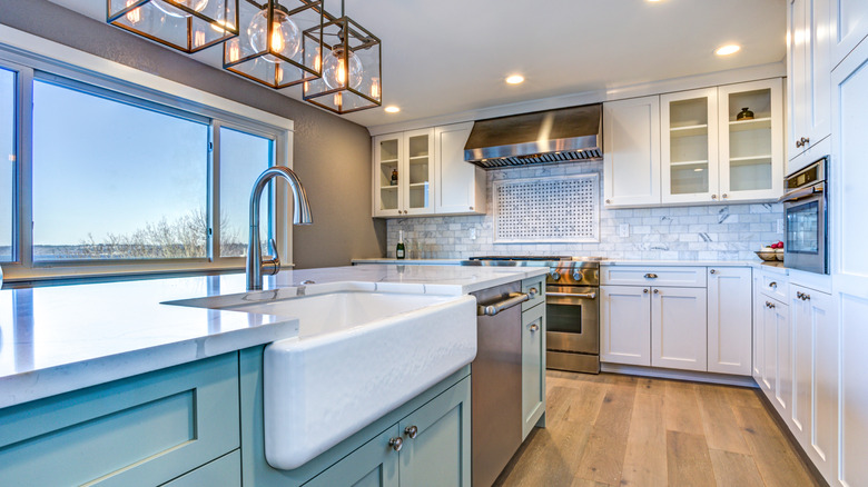a farmhouse sink in a modern kitchen with some rustic touches