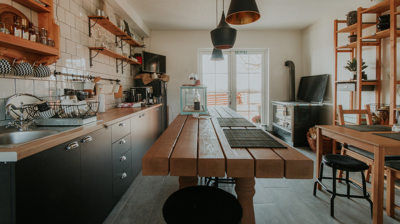 a wooden table as a kitchen island