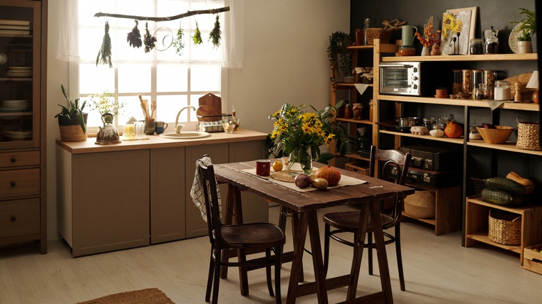 a rustic kitchen with unfitted furniture