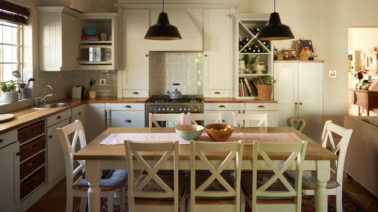 a country kitchen with a large kitchen table