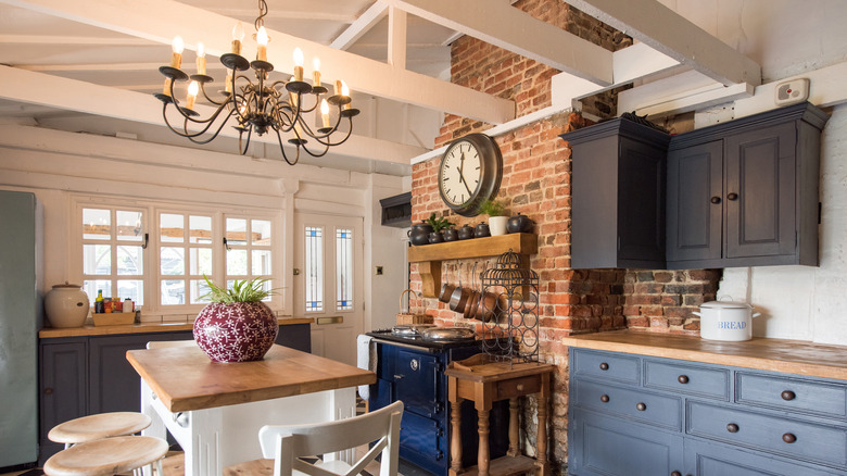exposed rafters painted white in a country kitchen