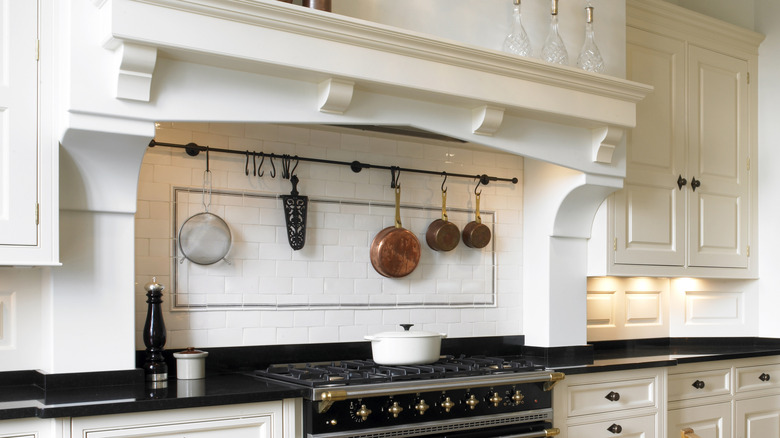 pots hanging over a stove