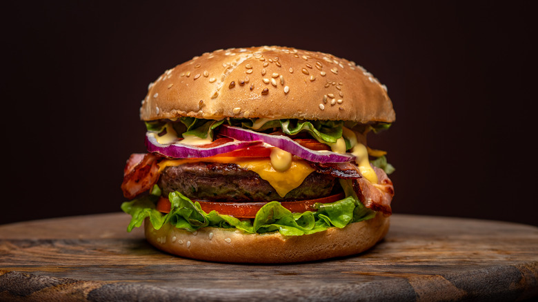 Beefburger with bacon, onions, and lettuce