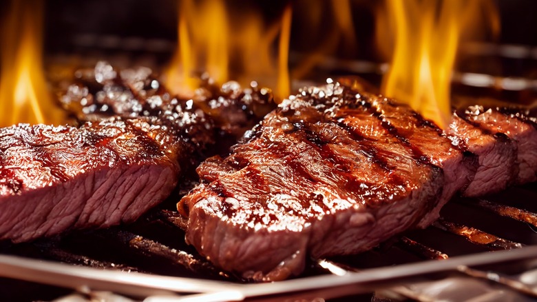 steaks on a hot grill