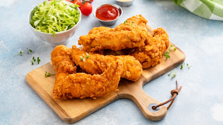 Fried chicken on wooden platter