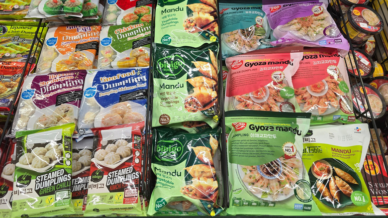 A selection of frozen Asian foods lie in a grocery store display