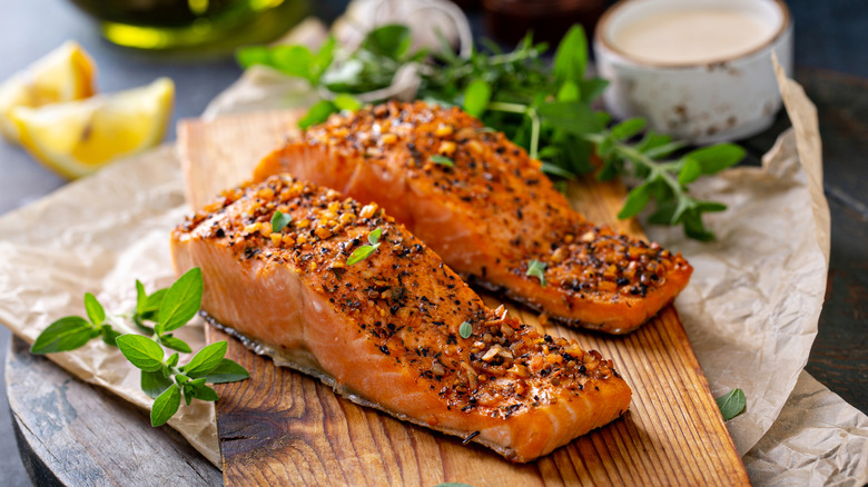 two salmon steaks on board