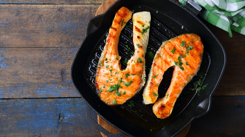 two salmon steaks in grill plan