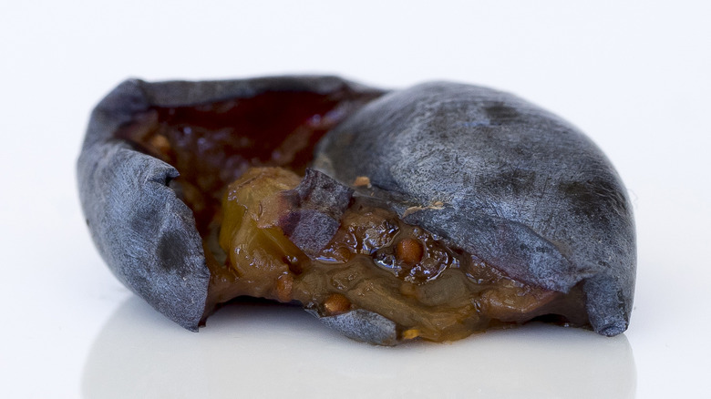 Close-up of overripe, mushy blueberry