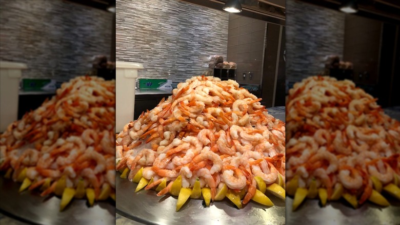A stack of shrimp on a buffet