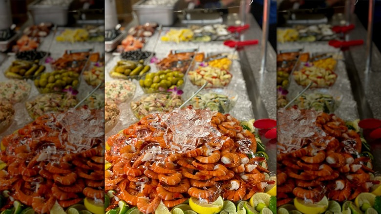 A stack of seafood on a buffet bar