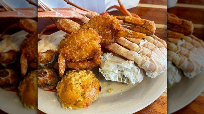 Closeup of a plate loaded with various seafoods at The Original Benjamin's seafood buffet