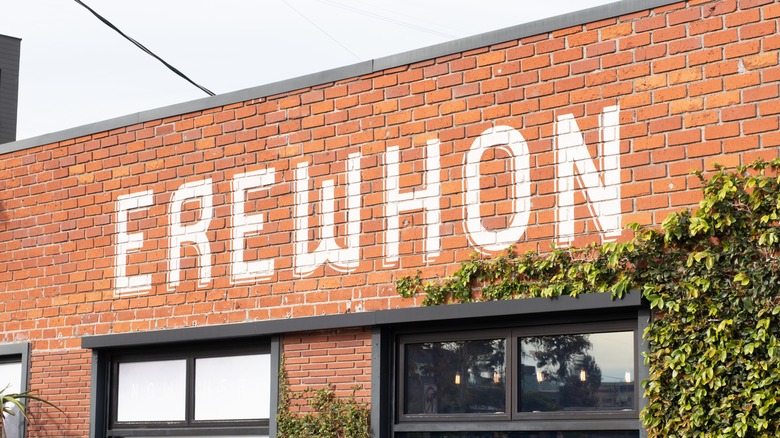 Erewhon Market storefront with green vines and black windows