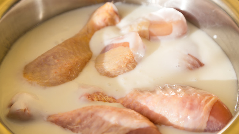 chicken marinating in buttermilk