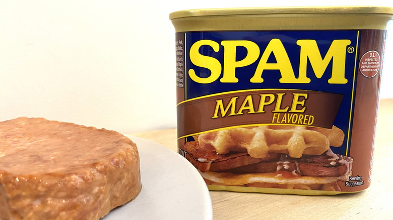 Slice of Spam Maple Flavored on a plate next to the can.