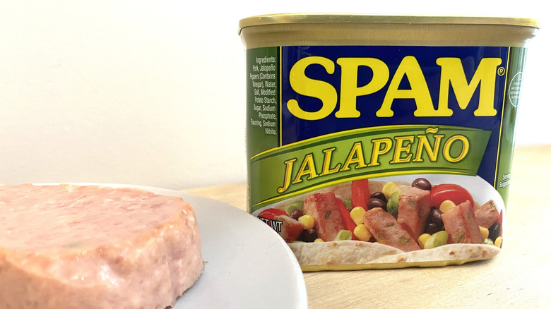 Slice of Spam Jalapeño on a plate next to the can.