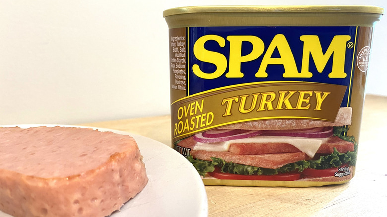 Slice of Spam Oven Roasted Turkey on a plate next to the can.
