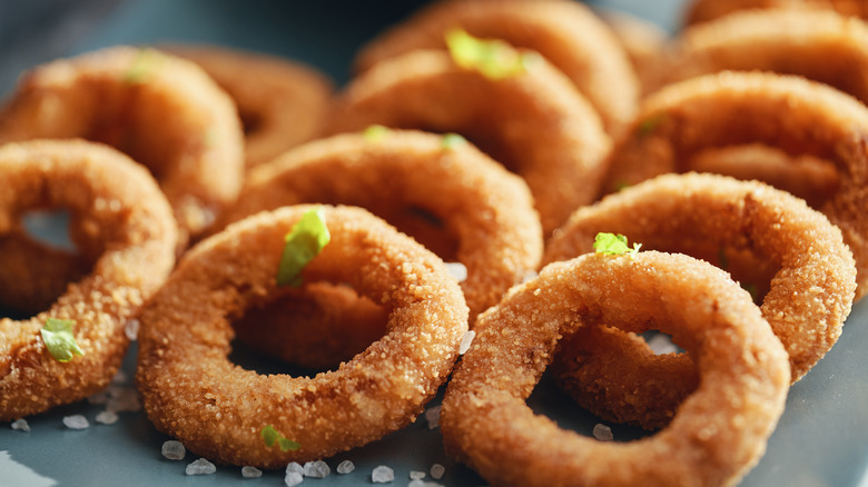 Closeup on onion rings with cilantro garnish