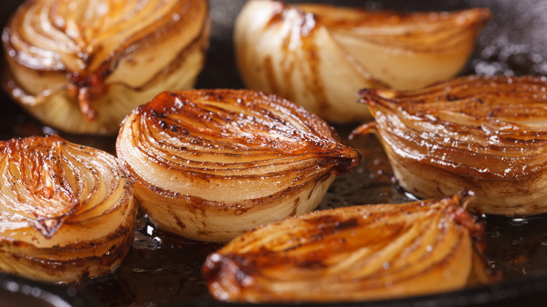 Cooked onions in a frying pan