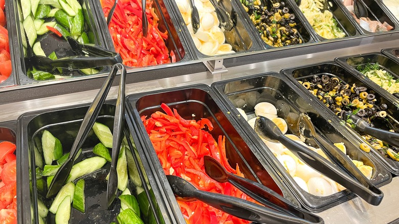 salad bar display with assorted vegetables