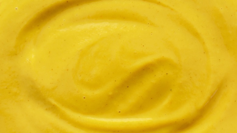 overhead texture shot of yellow mustard