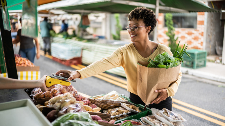 woman alone at a farmers market