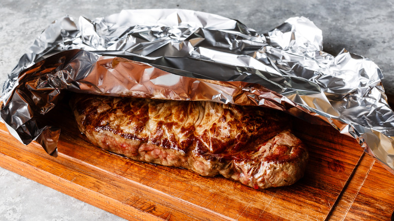 steak resting on a board