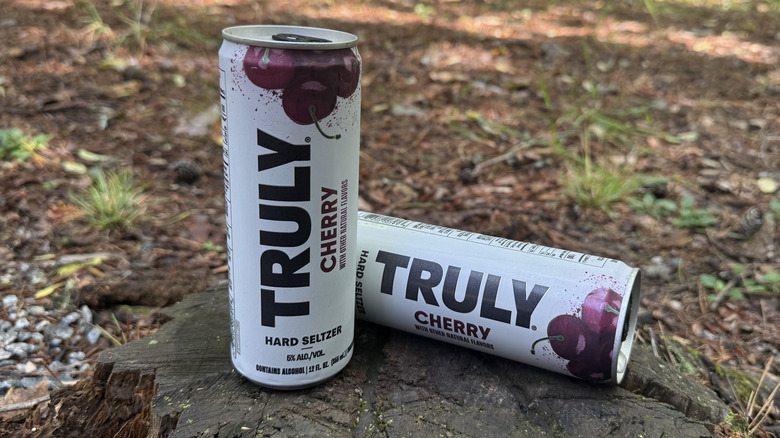 Two cans of cherry Truly seltzer